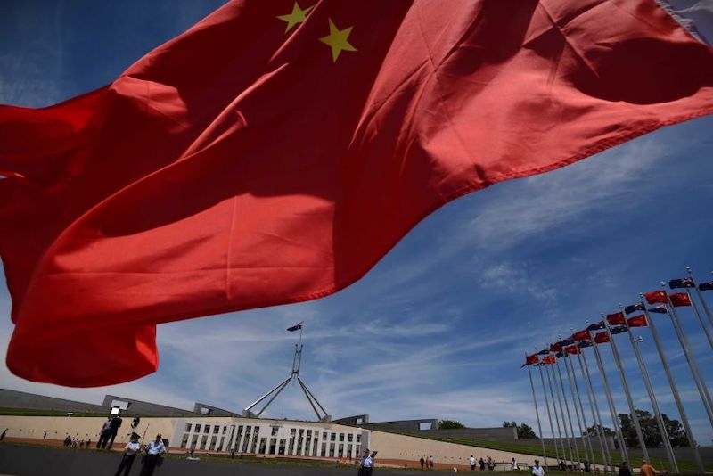 Photo of Chinese flag flying over Parliament House, Canberra