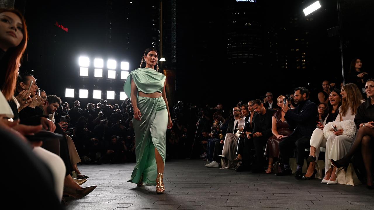 Model in green outfit