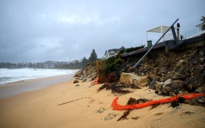 Dam spill heightens flood threat as storm wreaks havoc