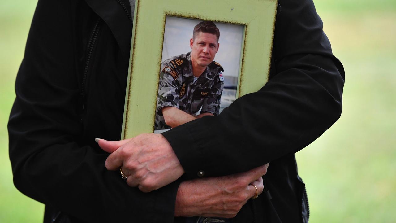 Julie-Ann Finney holds a framed photograph of her son David