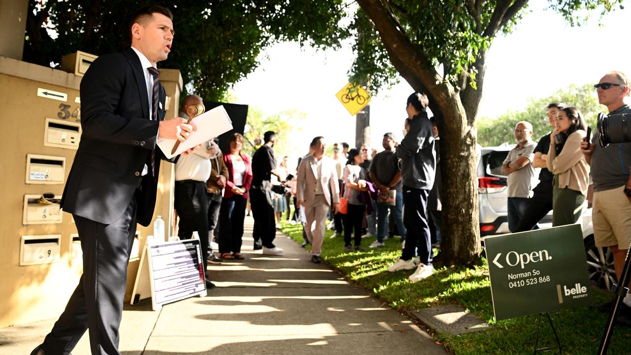 Auctioneer Jesse Davidson presides over a property auction