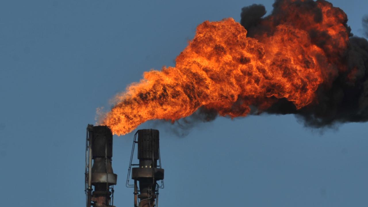 Smoke from an industrial chimney at the Shell Refinery in Geelong