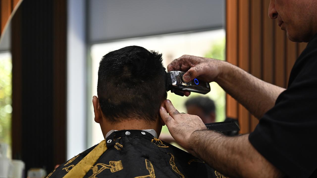 Man receives haircut