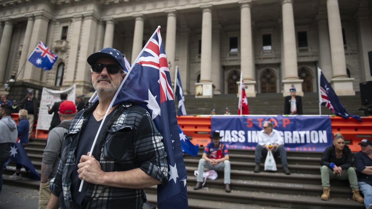 A man with an Australian flag at the March for Australia 