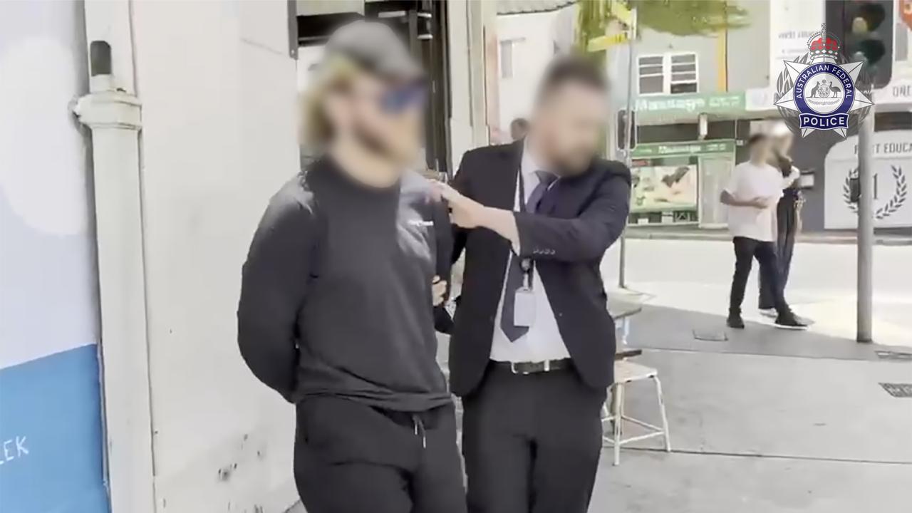 Joel Davis being arrested