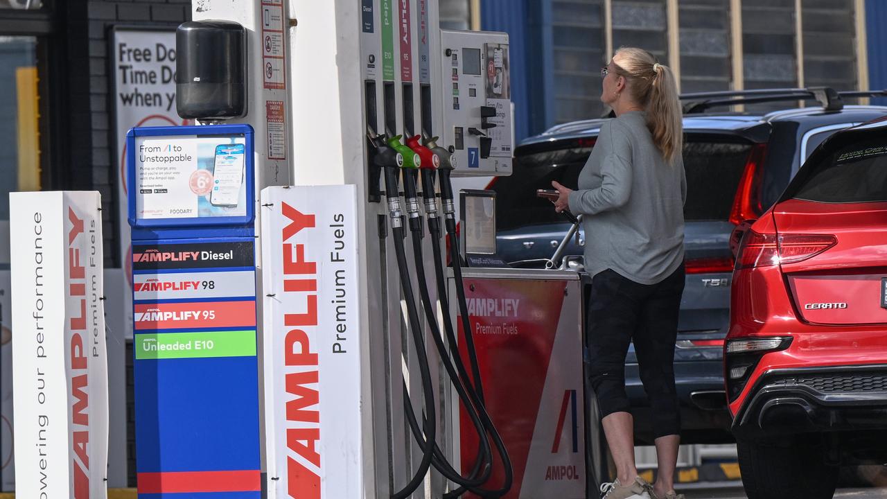A motorist filling up her car