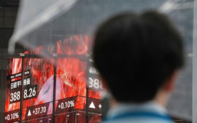 Asian shares mixed as gold and silver hit record highs