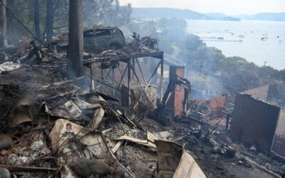 Wind change heightens fire risk as a dozen homes lost