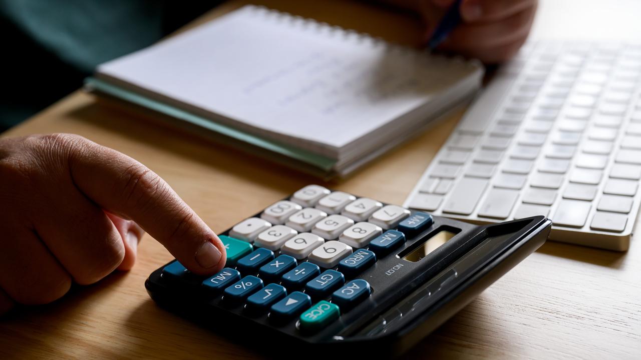 A person using a calculator (file image)