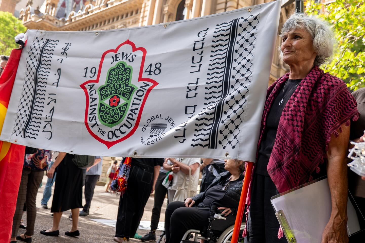 Jews against the occupation banner at Sydney Town Hall Vigil on 22 December 2025. Credit: Zebedee Parkes