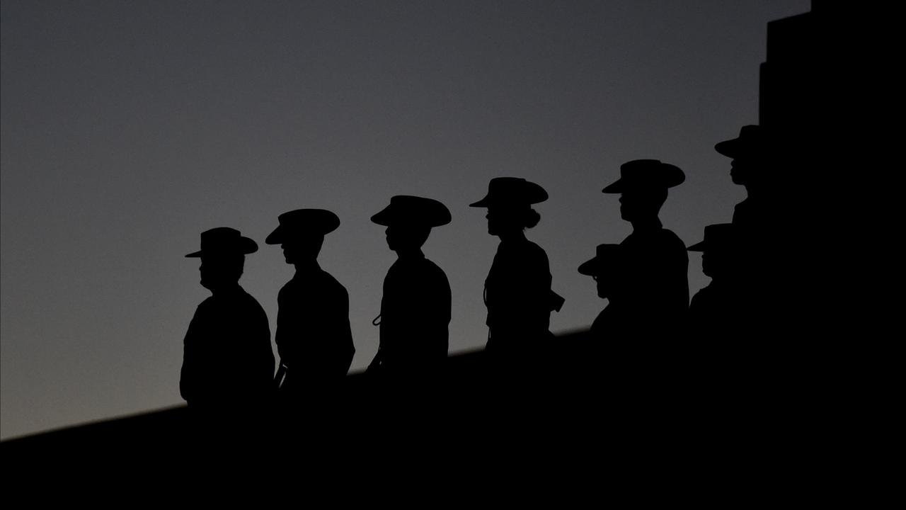 Members of the defence force stand during the Dawn service