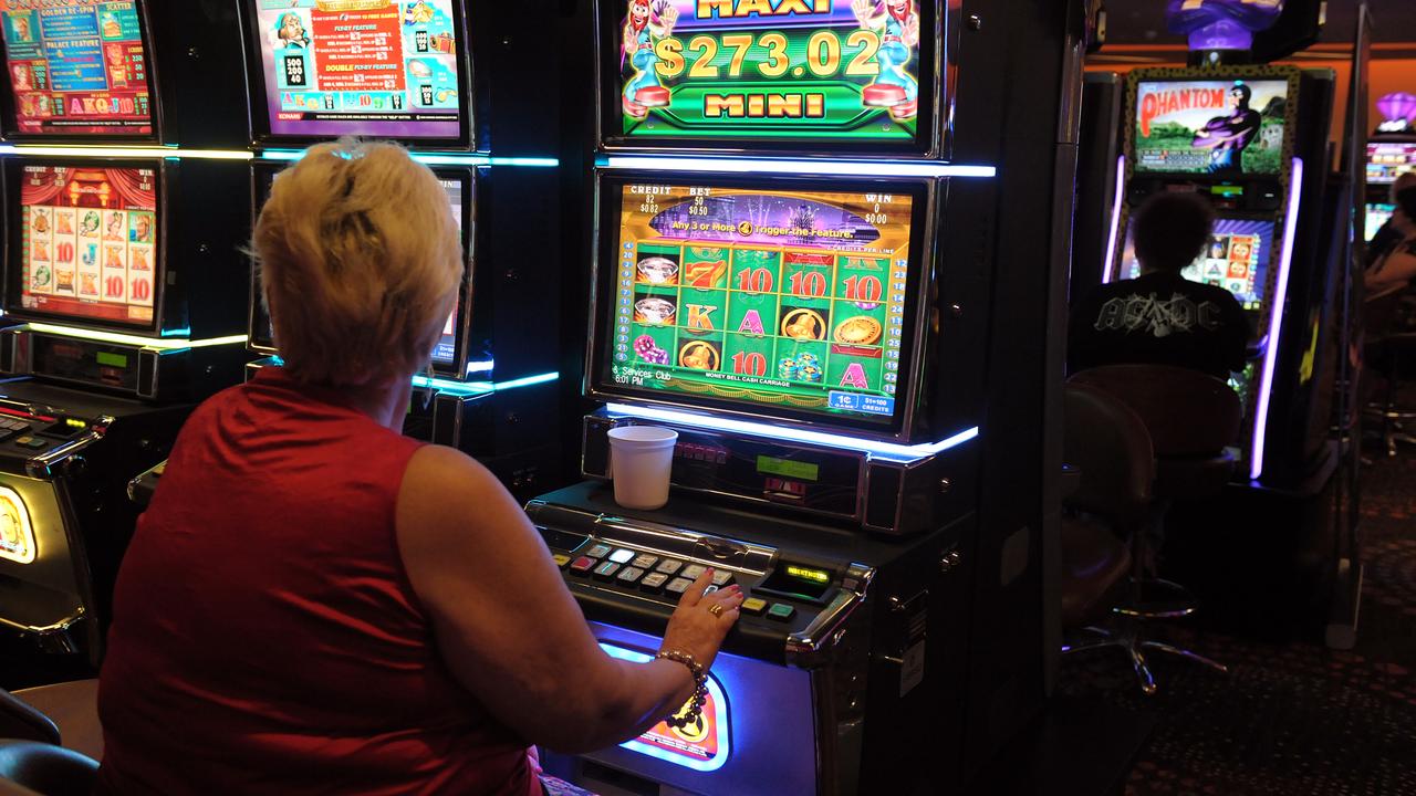 Gamblers play poker machines (file image)