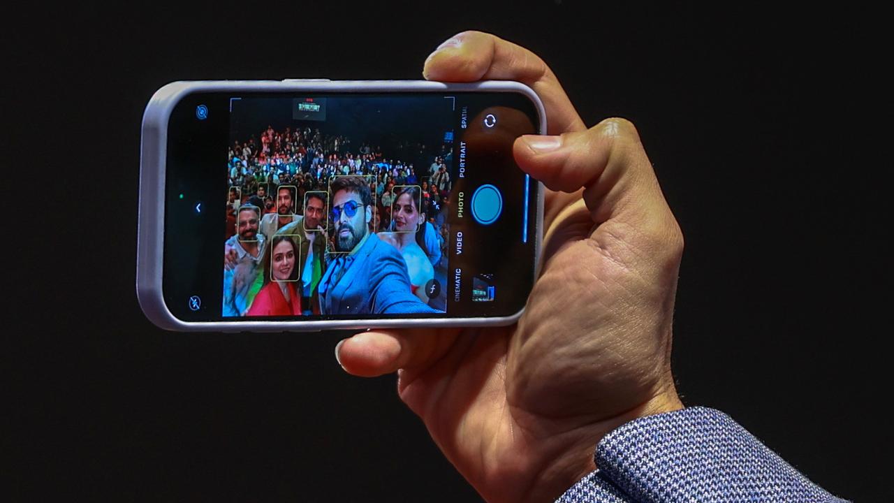 Indian actor Emraan Hashmi takes a selfie on a mobile phone