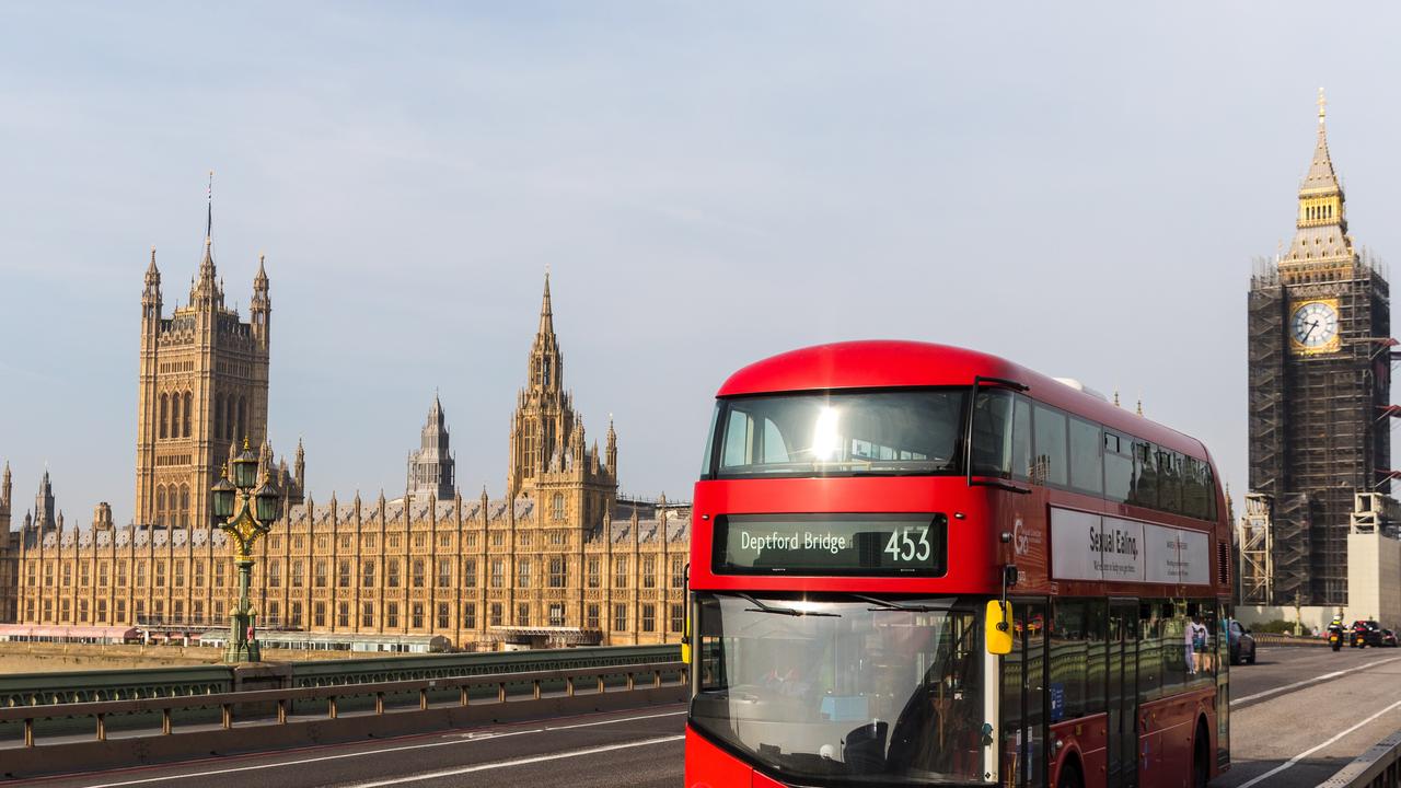 A bus travels across Westminster Bridge in front of Big Ben