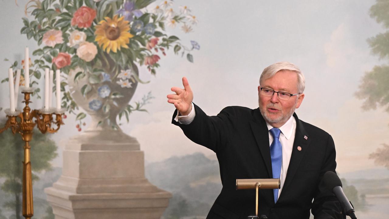 Kevin Rudd points to reporters