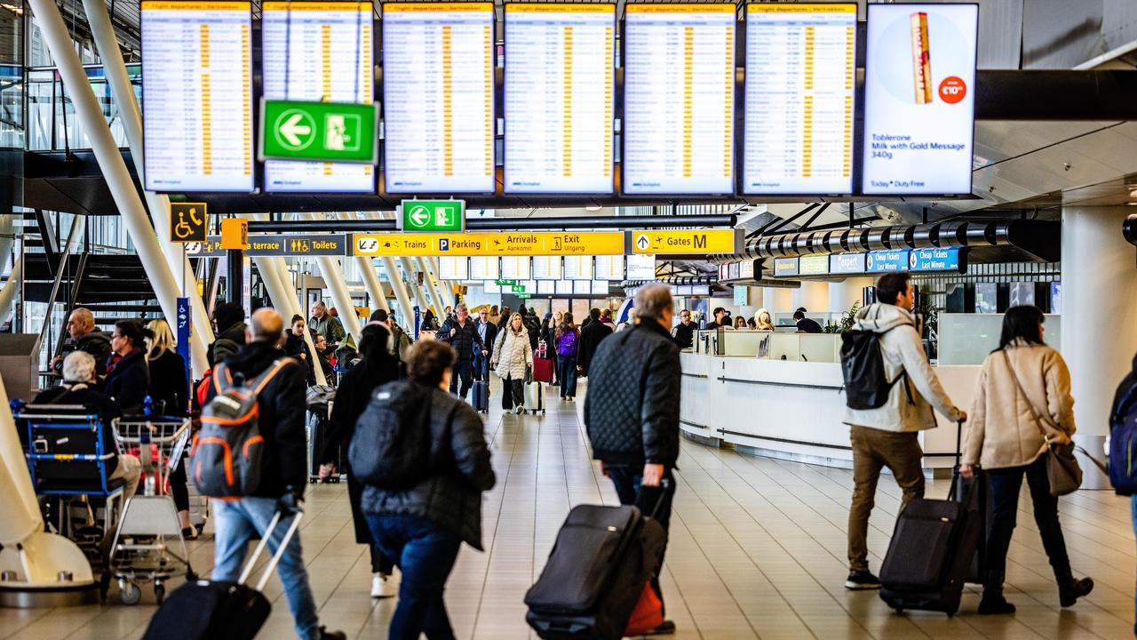 Travellers at Schiphol Airport