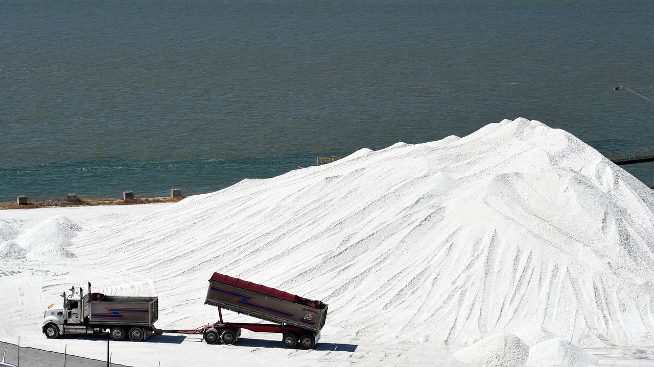 A truck offloads magnesite