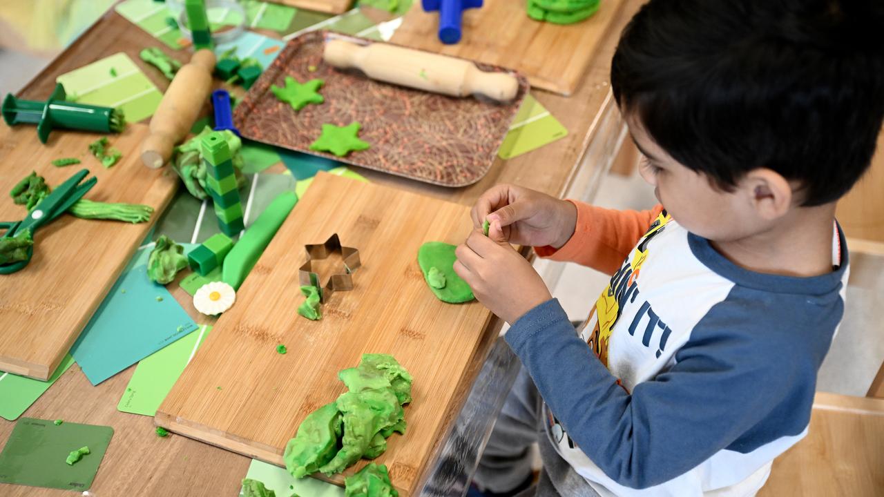 A child plays with playdough