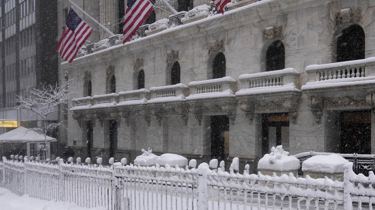 Boy plays in snow outside NYSE