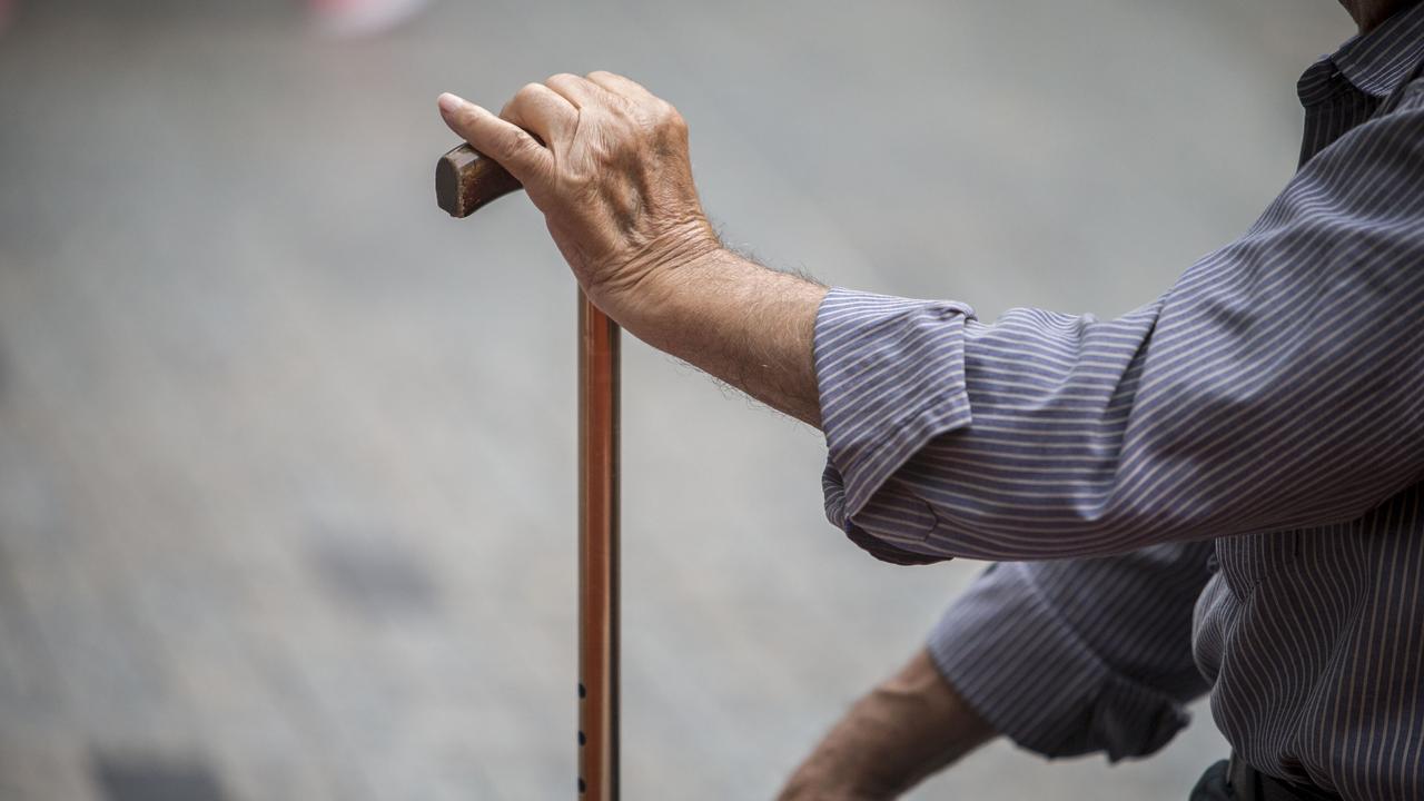 A person holds a walking stick (file image)