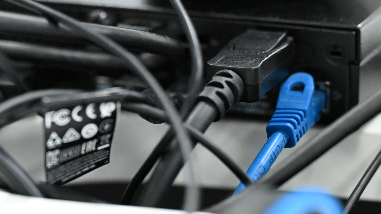 Ethernet cables are seen plugged into a computer (file image)