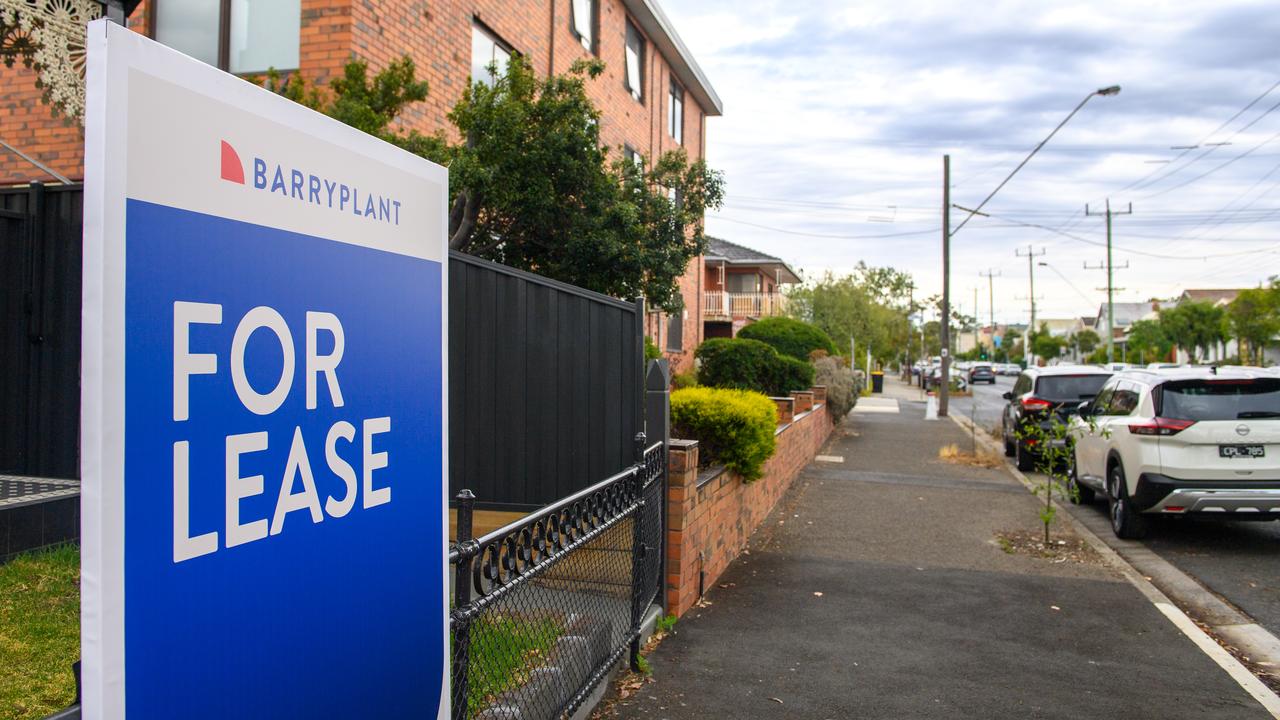 A for lease sign outside an apartment building
