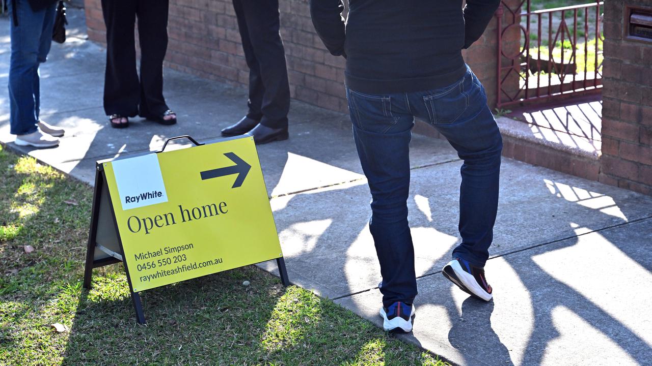 Buyers inspect an open house