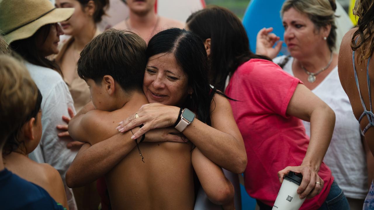 Nico Antic mother Lorena (centre) comforted by friends