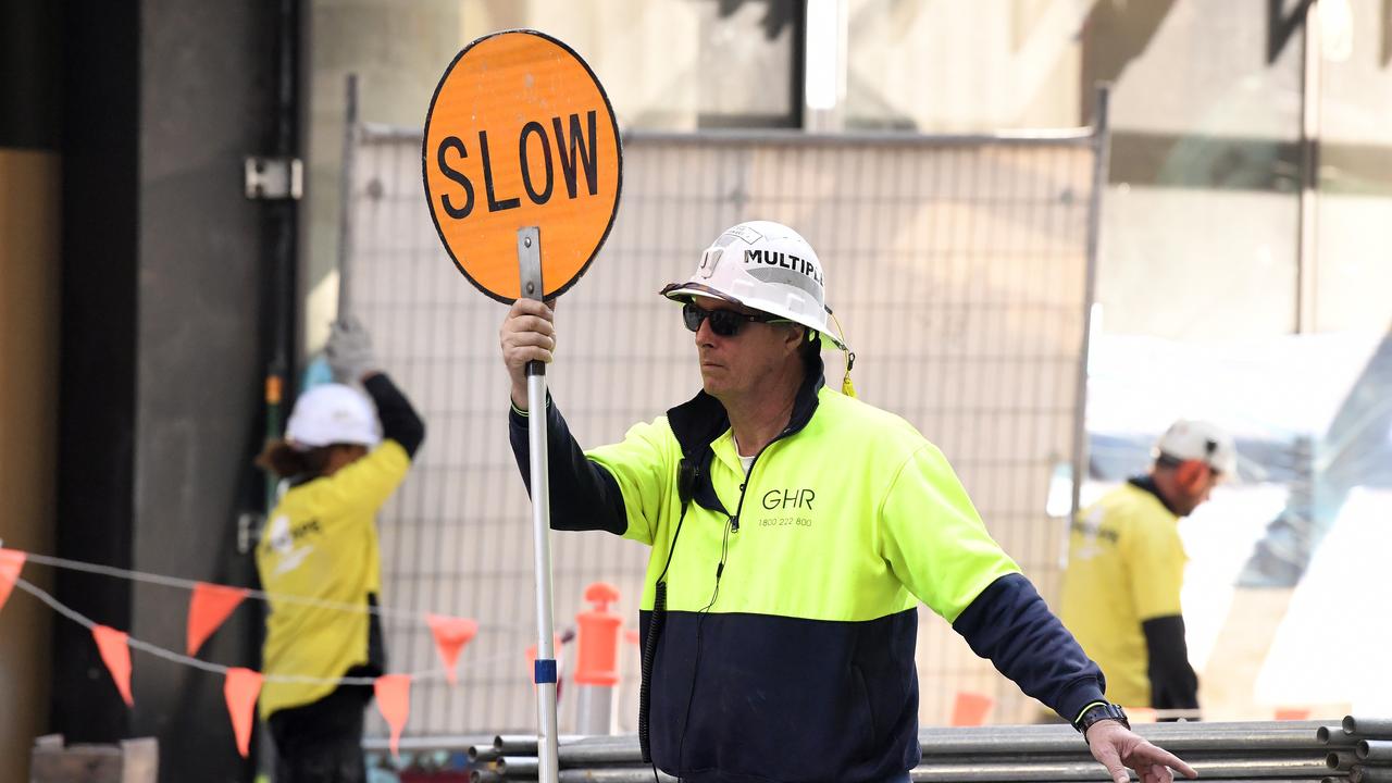 A worker holds a slow sign (fvile image)