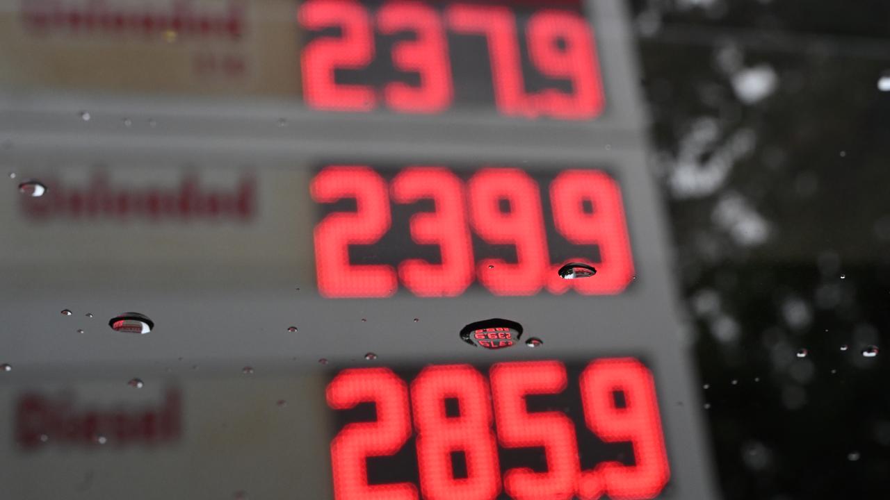 Fuel prices reflected in a rain drop