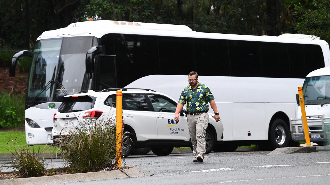 A bus and security are seen at the Royal Pines resort