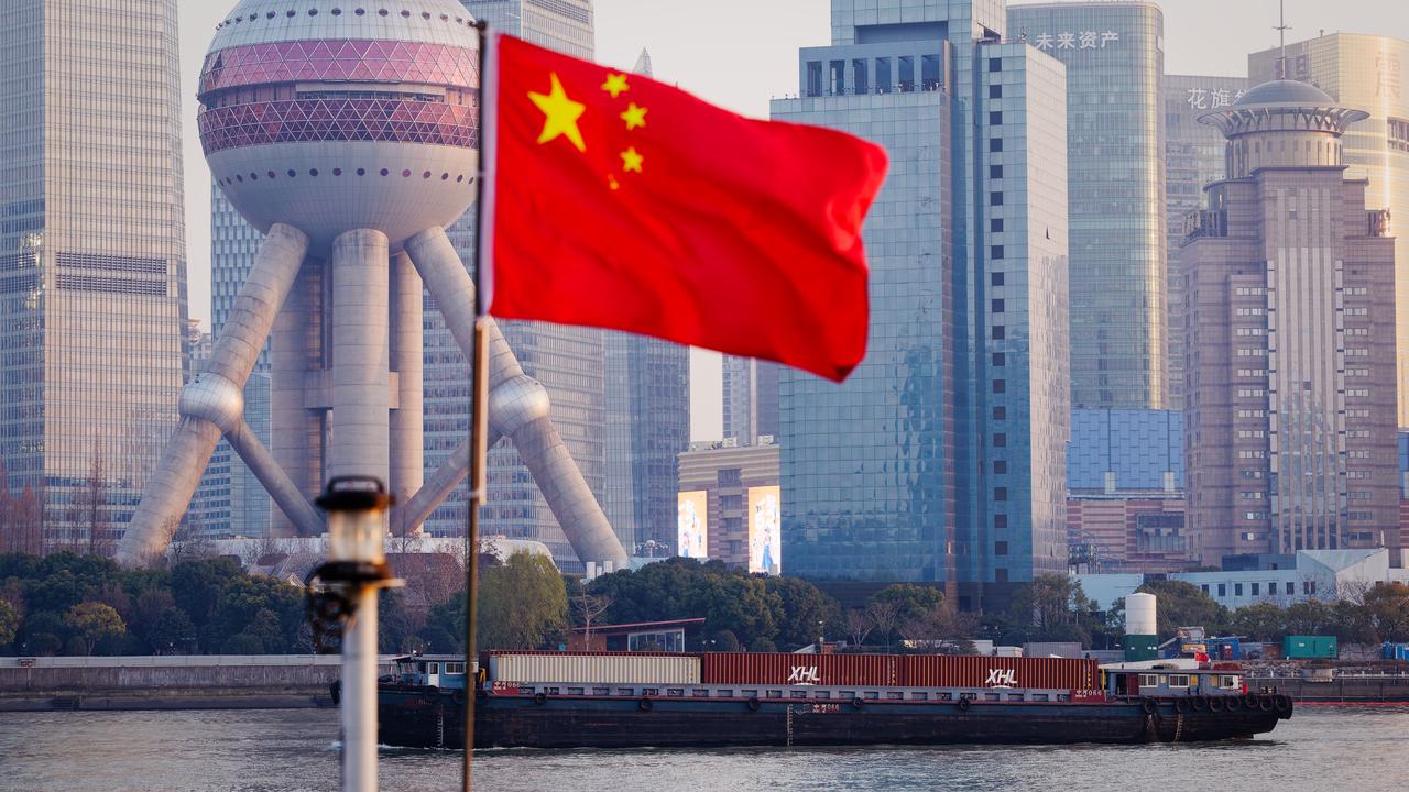 Cargo ships sail on Huangpu River in Shanghai