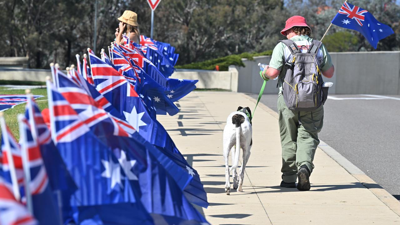 A protester walks her dog