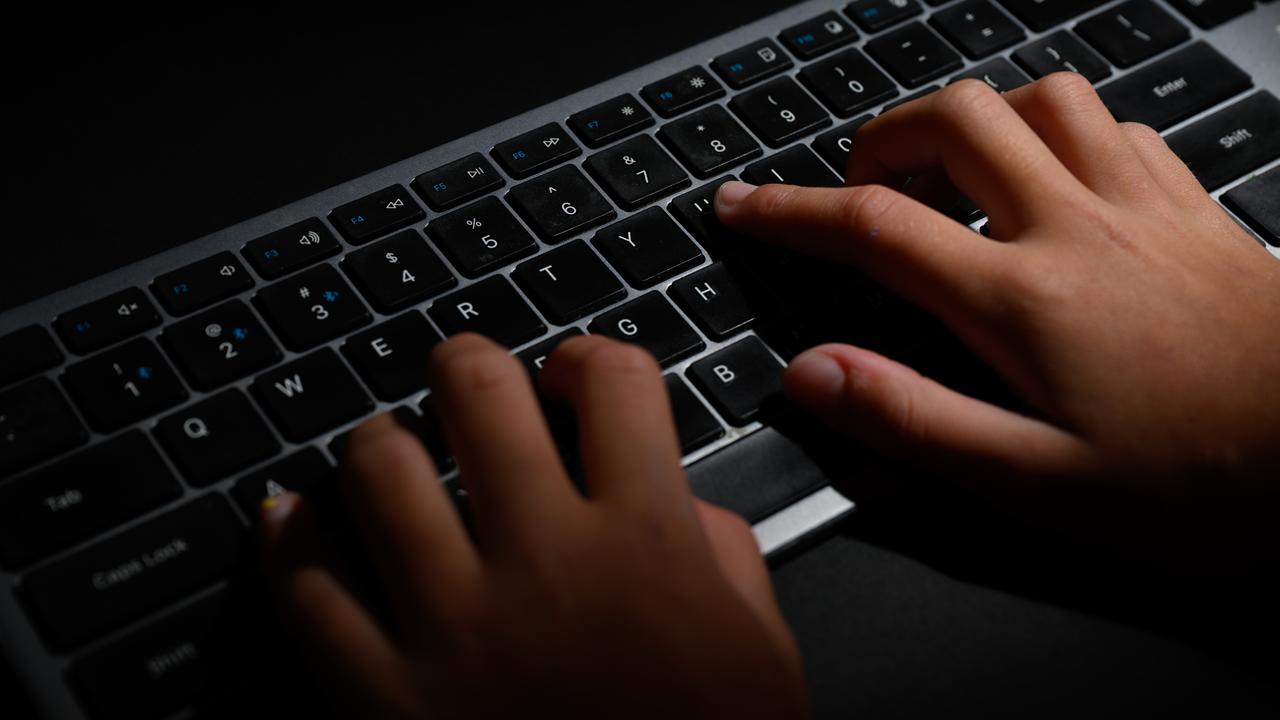 Hands on a computer keyboard