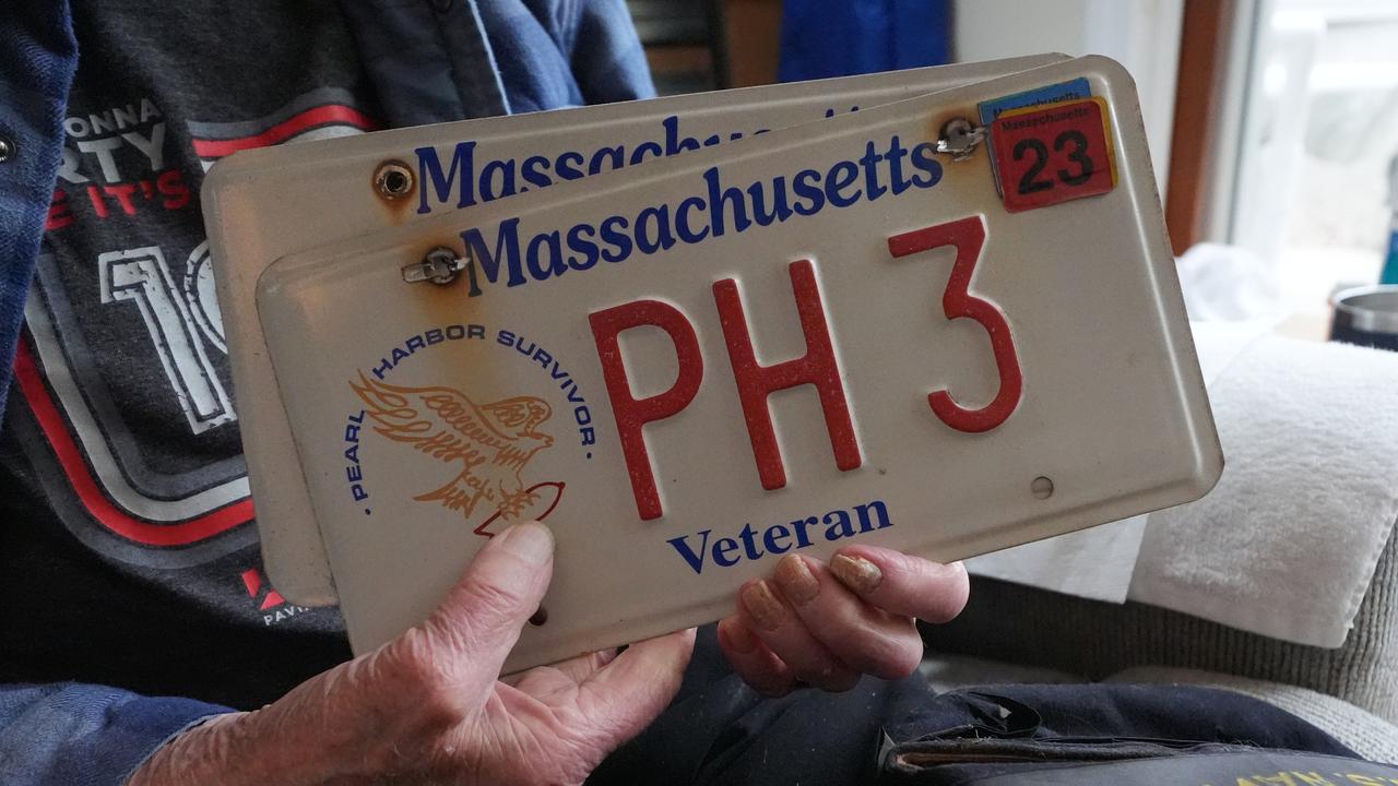 Freeman Johnson holding up his veteran number plates
