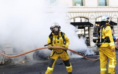 Protesters smash windows, set Tesla ablaze in G7 march