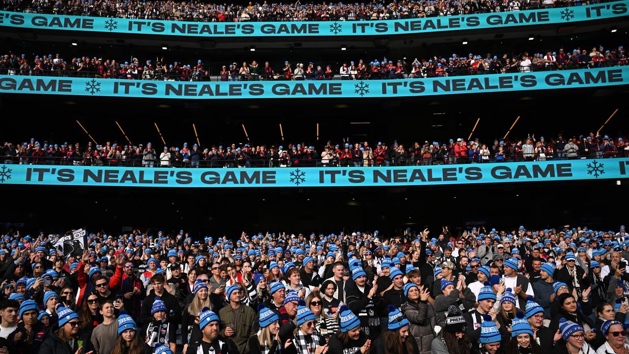 Supporters watch on as Neale Daniher makes a Lap of Honour