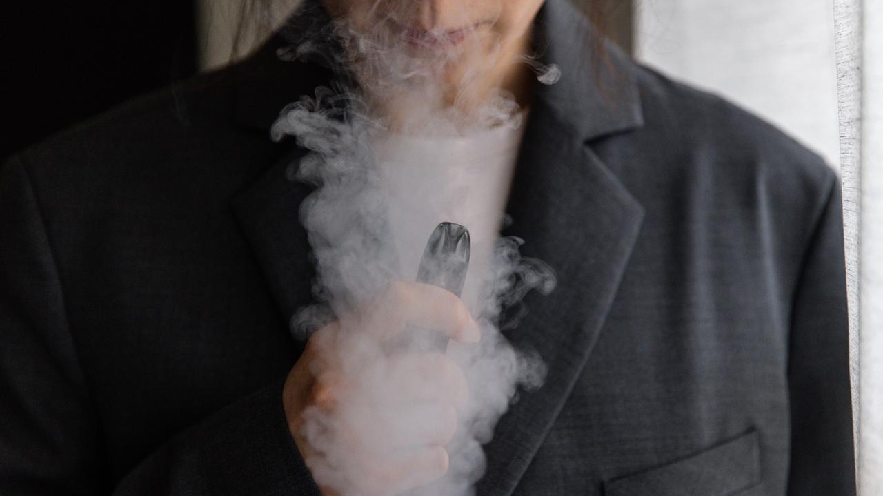 A woman is seen vaping (file image)