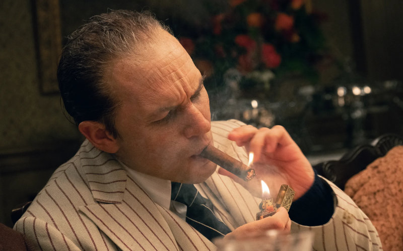 Al Capone lights a cigar
