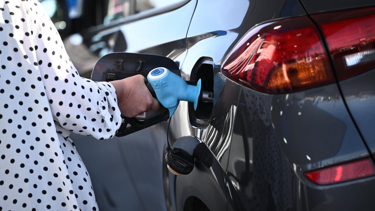A motorists fills up a car with fuel (file image)