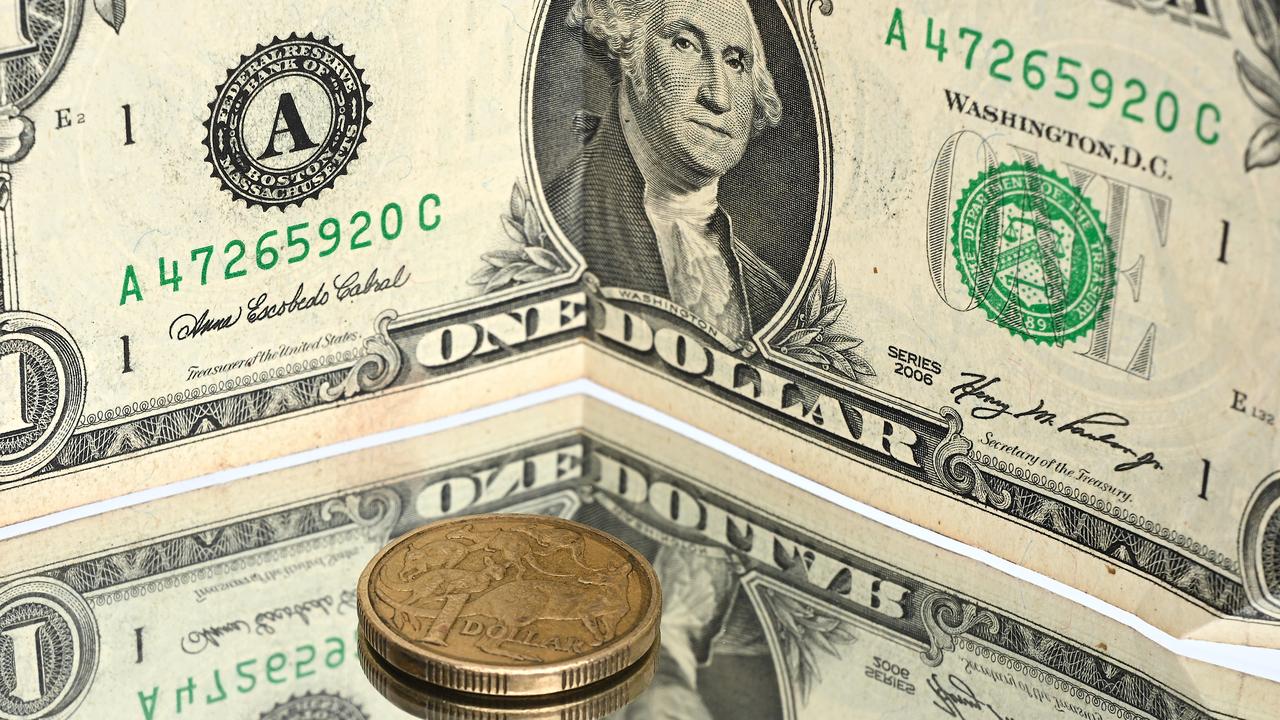 A US dollar note and Australians coin (file image)