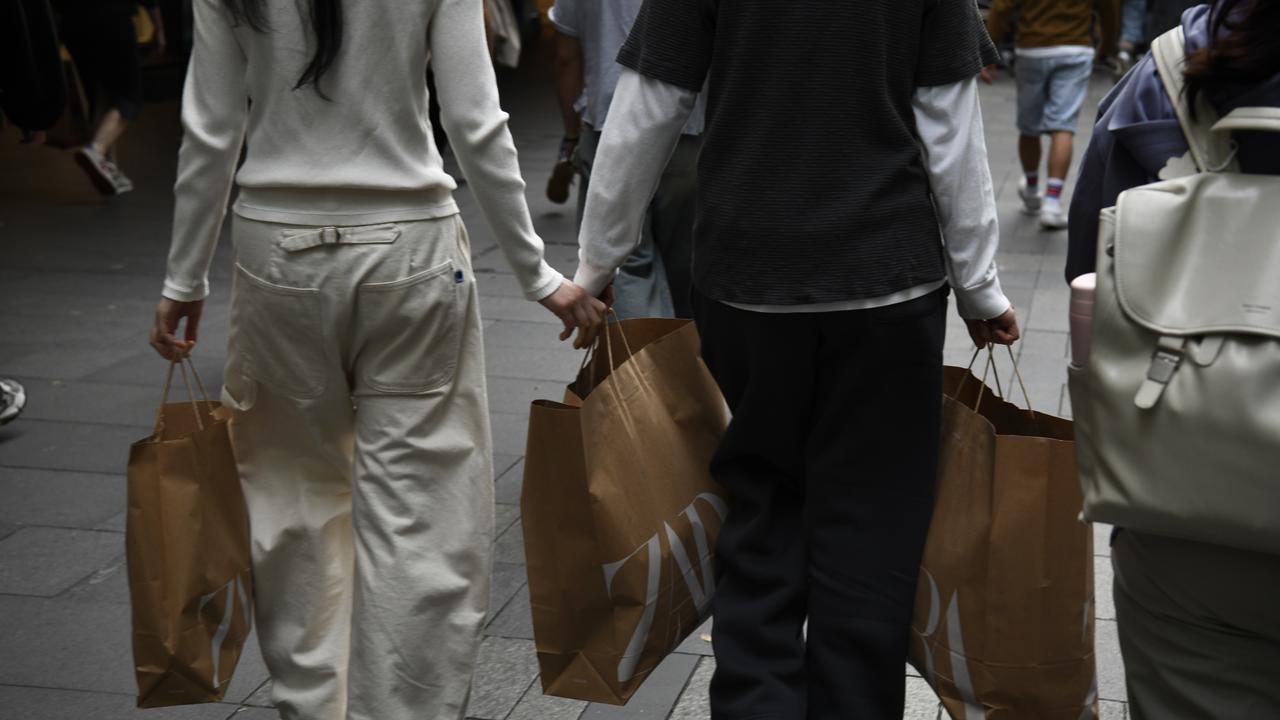 People are seen in the CBD, in Sydney,