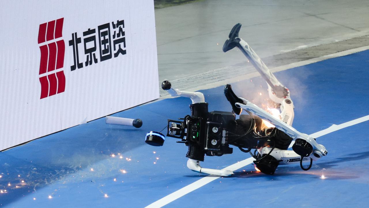 A humanoid robot falls down during a 400m event